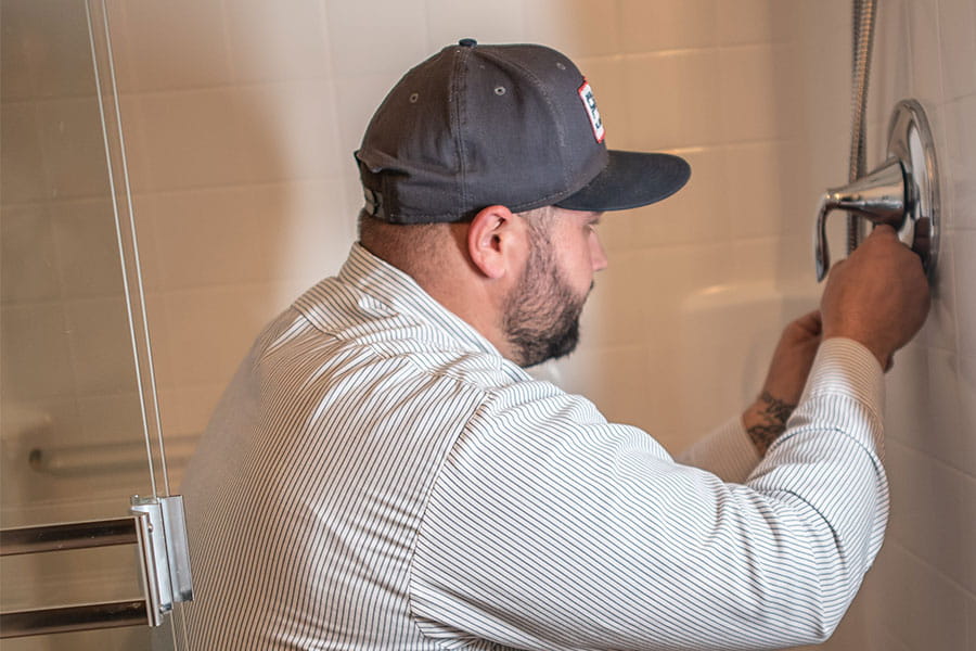 Shower valve replacement in progress
